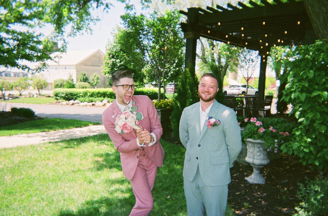 Devon with a groom just after a ceremony, both laughing
